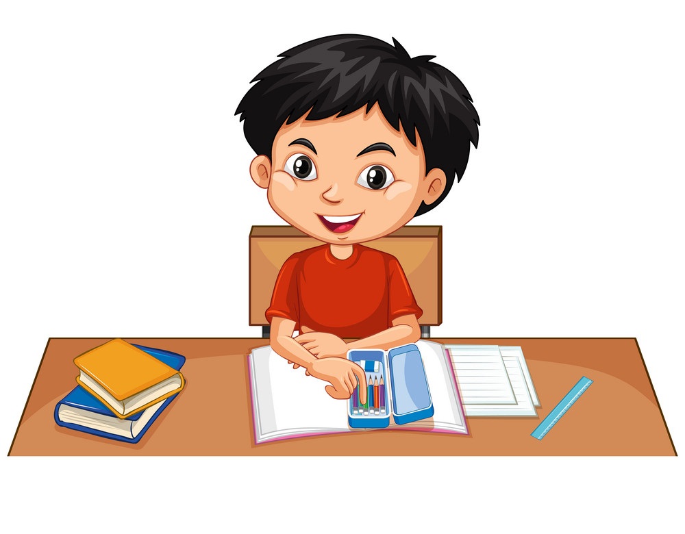 boy doing homework on desk