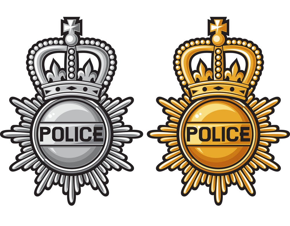gold and silver police badge