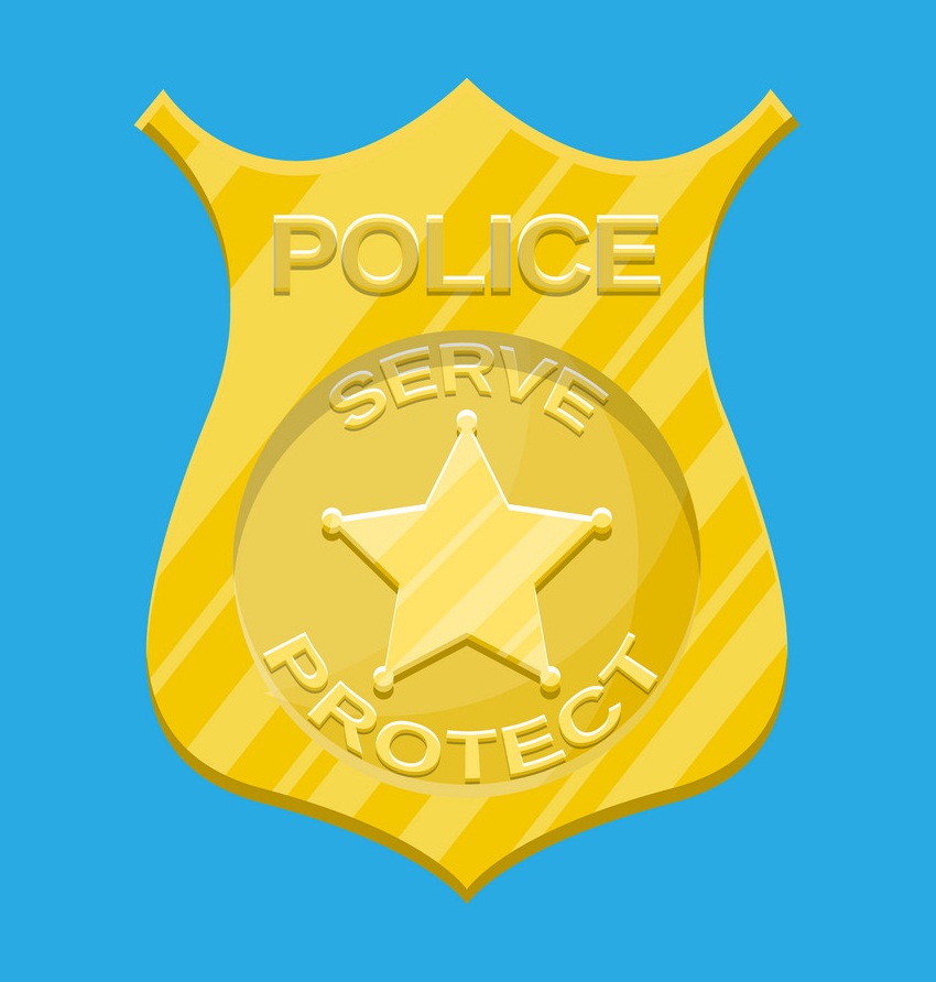 gold police badge on blue background
