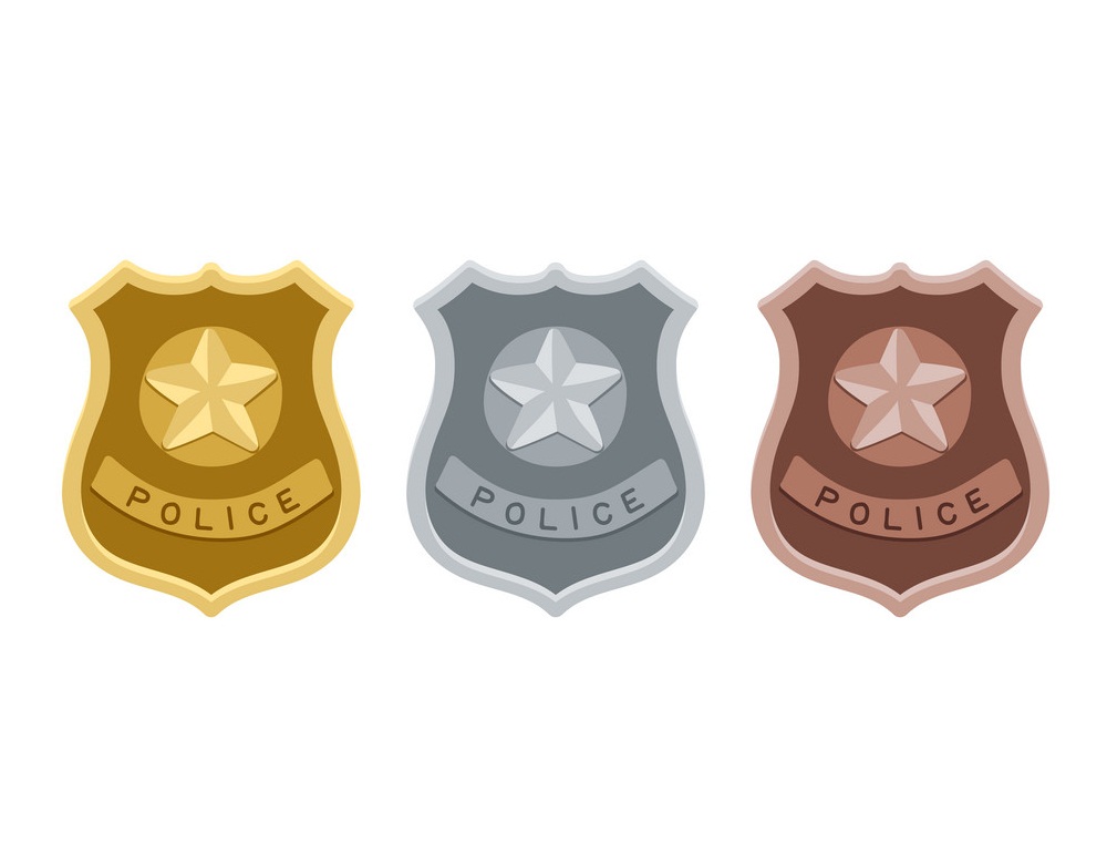 gold, silver and bronze police badge