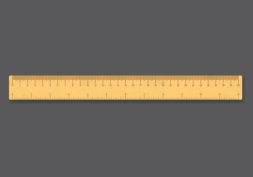 wooden ruler on gray background