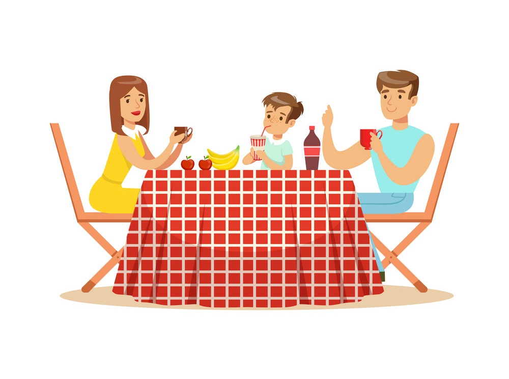 family having lunch outdoors